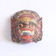 Two polychrome painted and gold leaf gilded Barong dance masks from Bali, Indonesia.