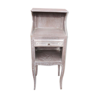 Old bedside table in grey cerusé wood