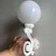 Antique enamelled cast iron wall lights / opaline globe