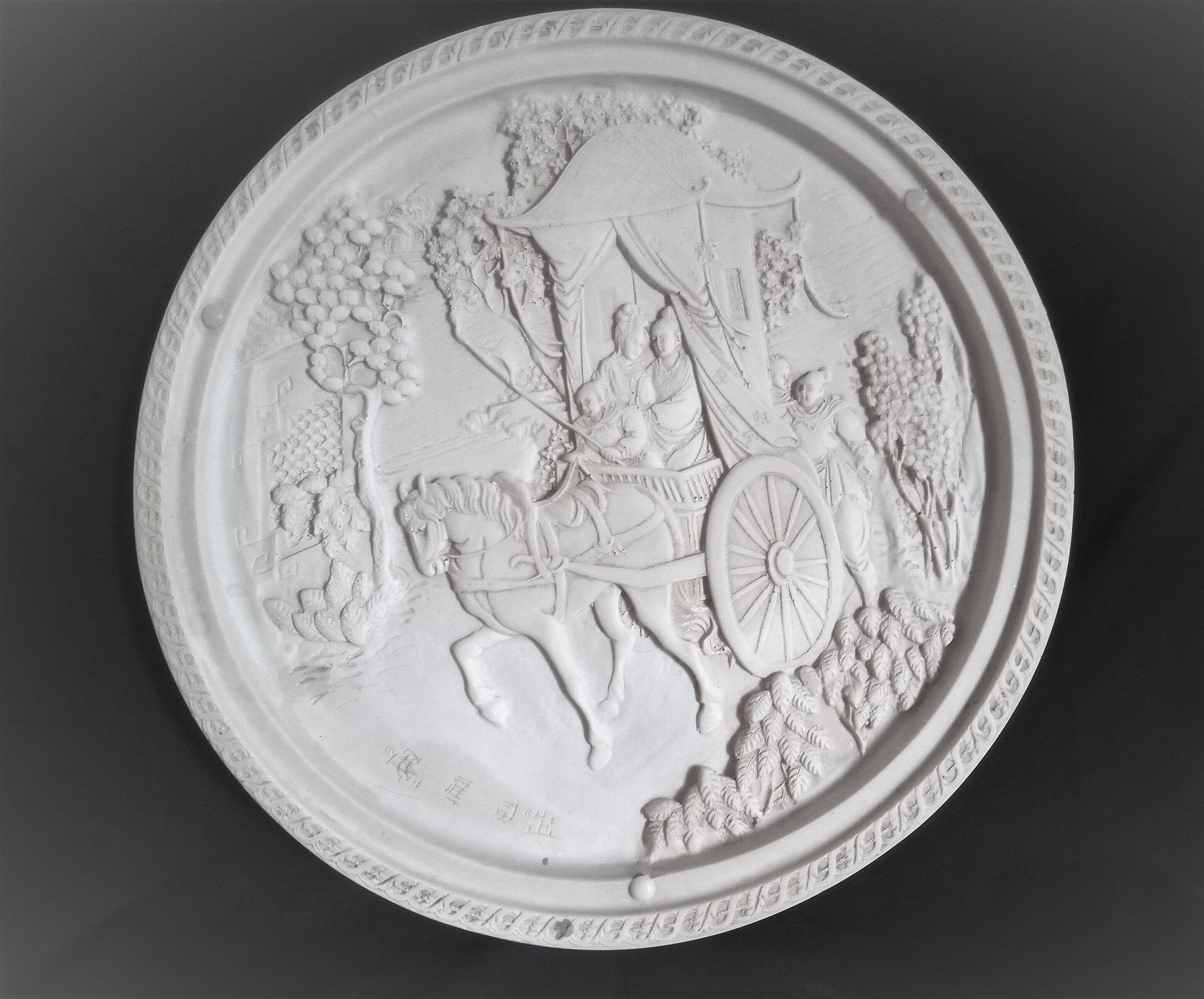 Large Chinese resin dish, sculpted motifs, signed