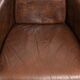 Cowhide armchair in Aviator design in a warm brown colour