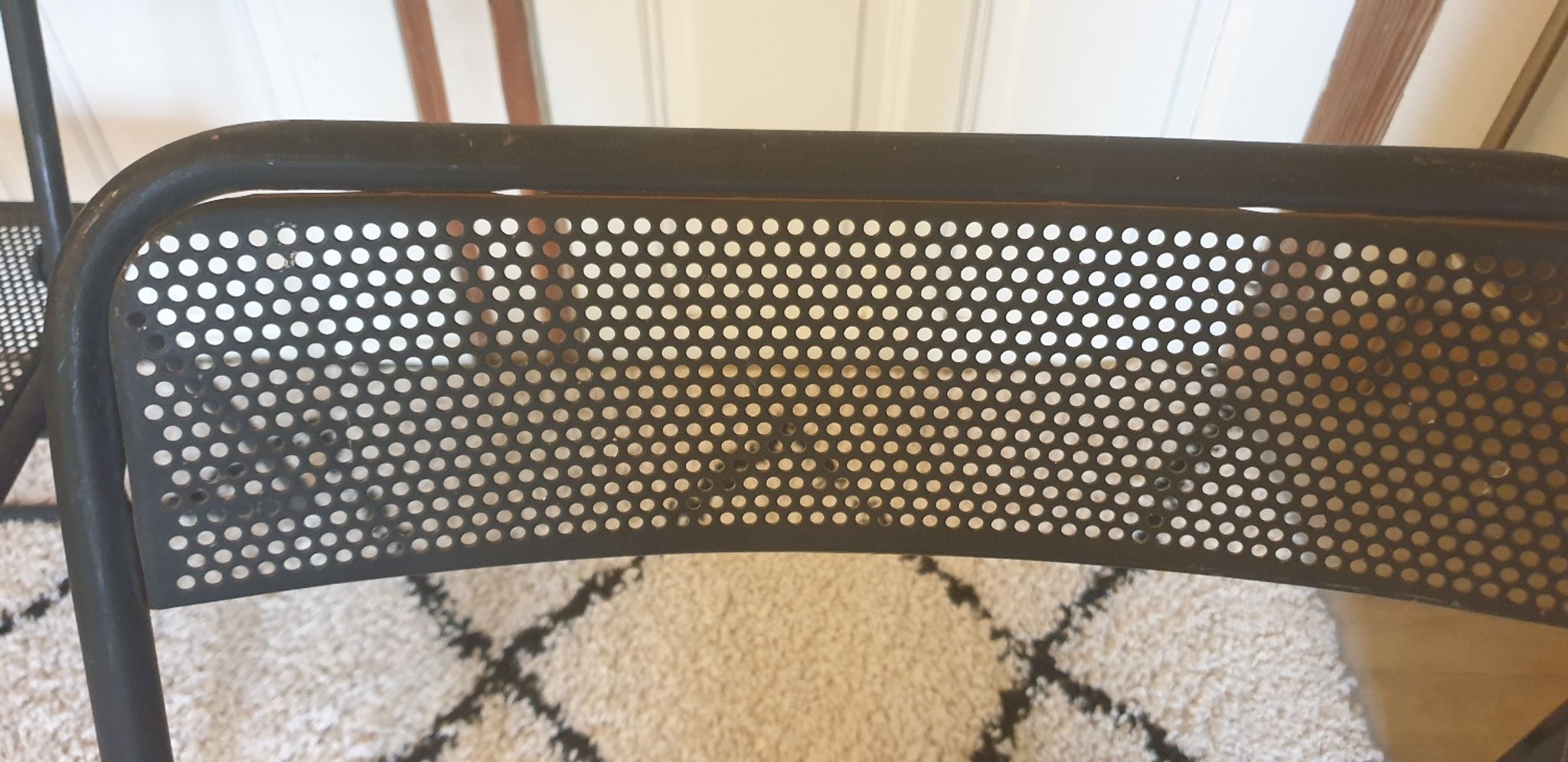 Pair of folding chairs in perforated metal