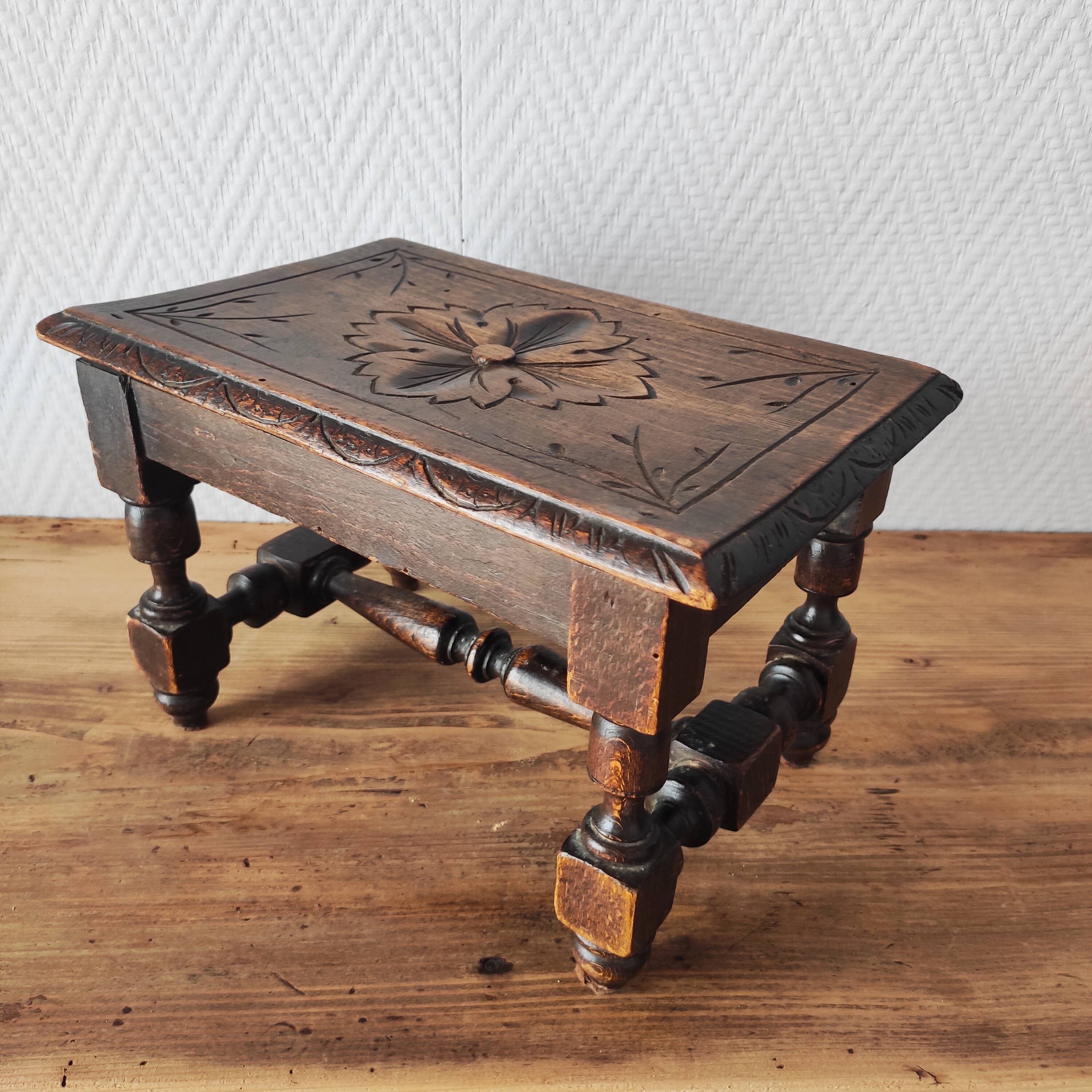 Old carved wooden footrest