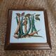Dessous de plat ancien avec motif botanique