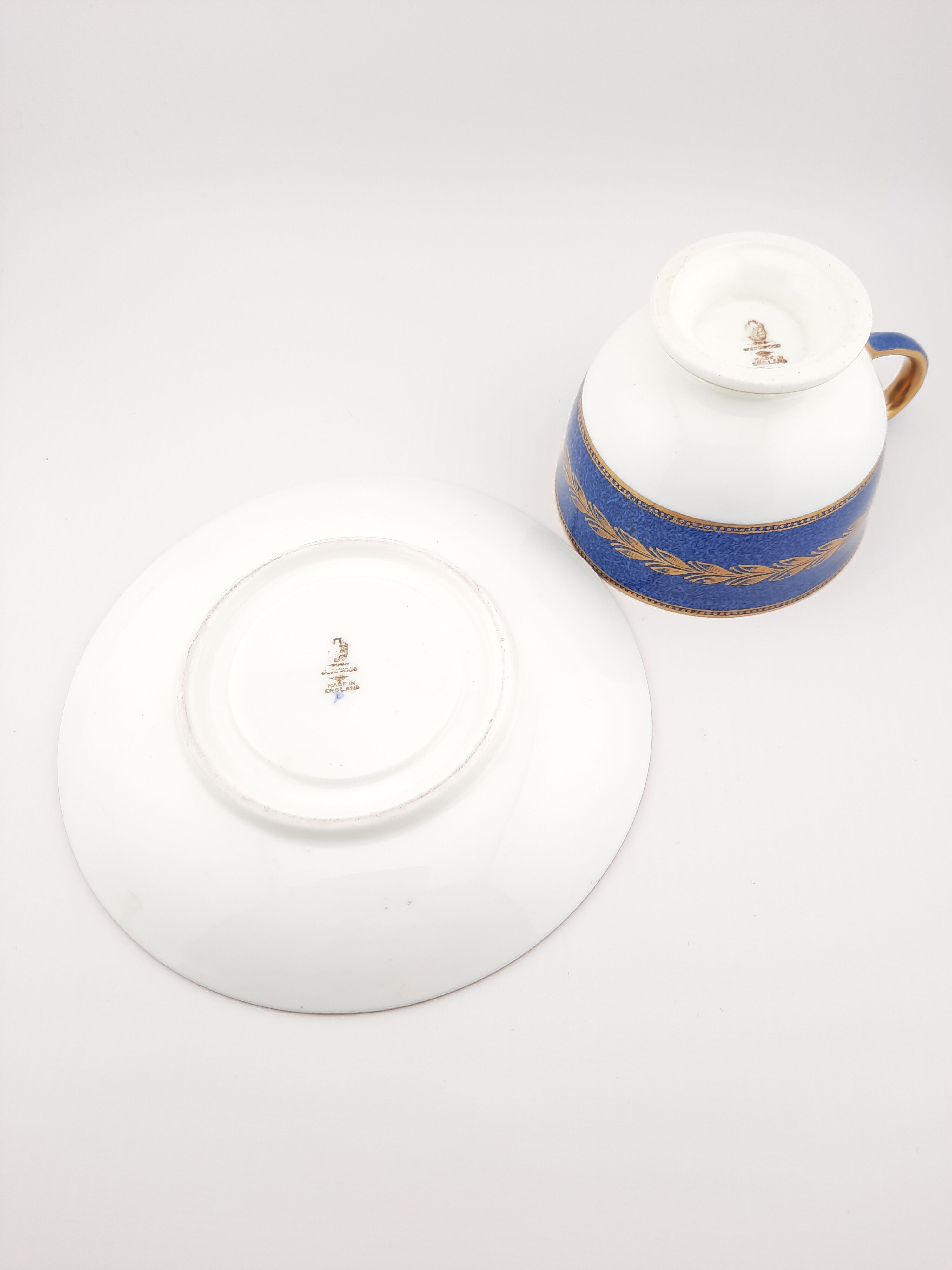 Antique Wedgwood teacup and saucer, bone china. Powder blue and gold English footed cup and saucer,