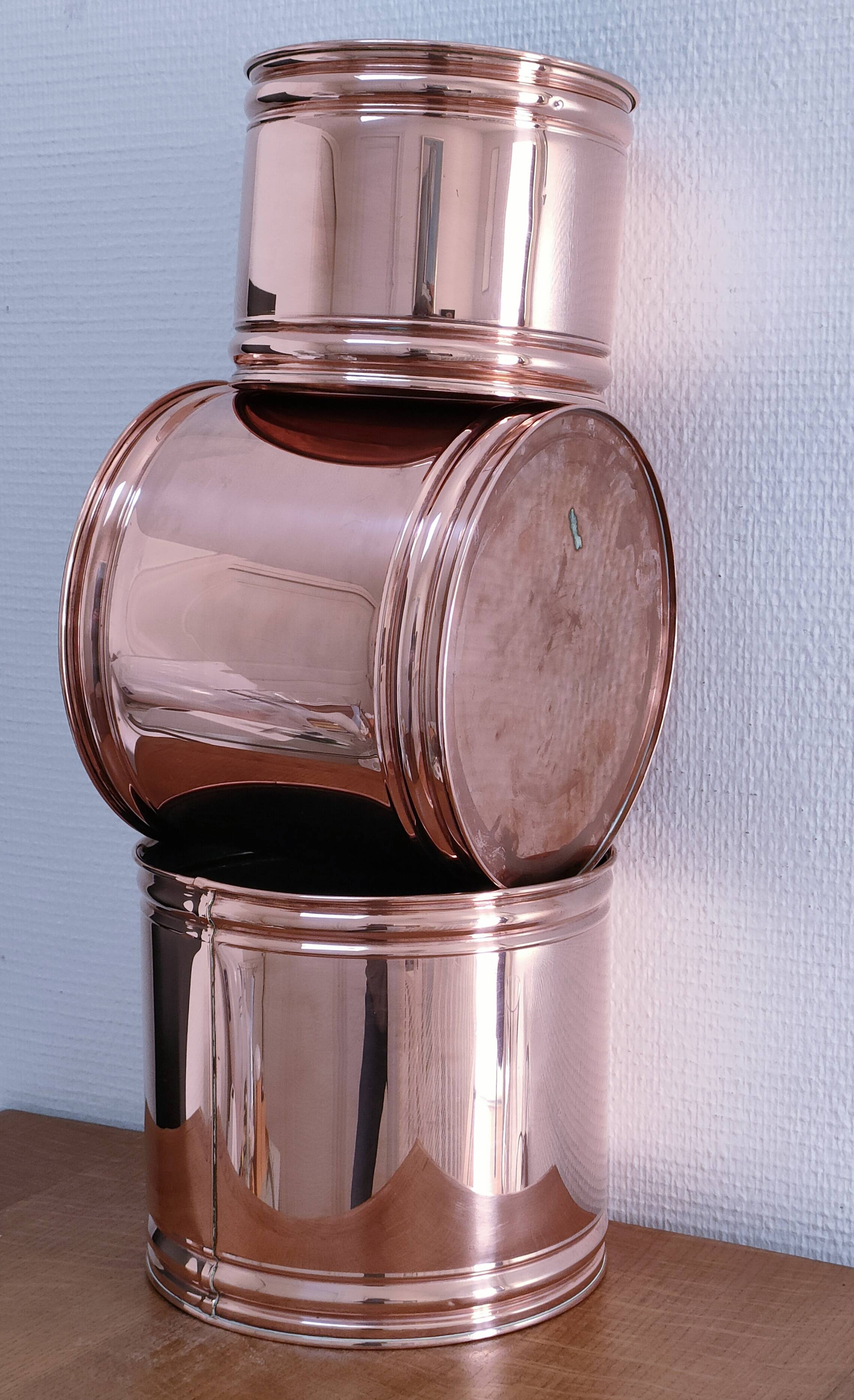 three cylindrical plant pots in a Scandinavian design from the 80s