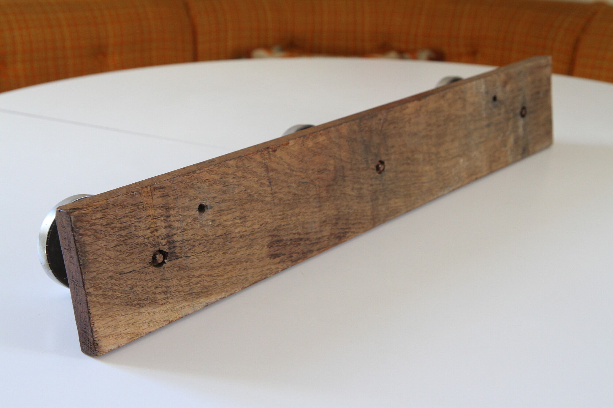 Wooden and stainless steel coat holders from the 1920s