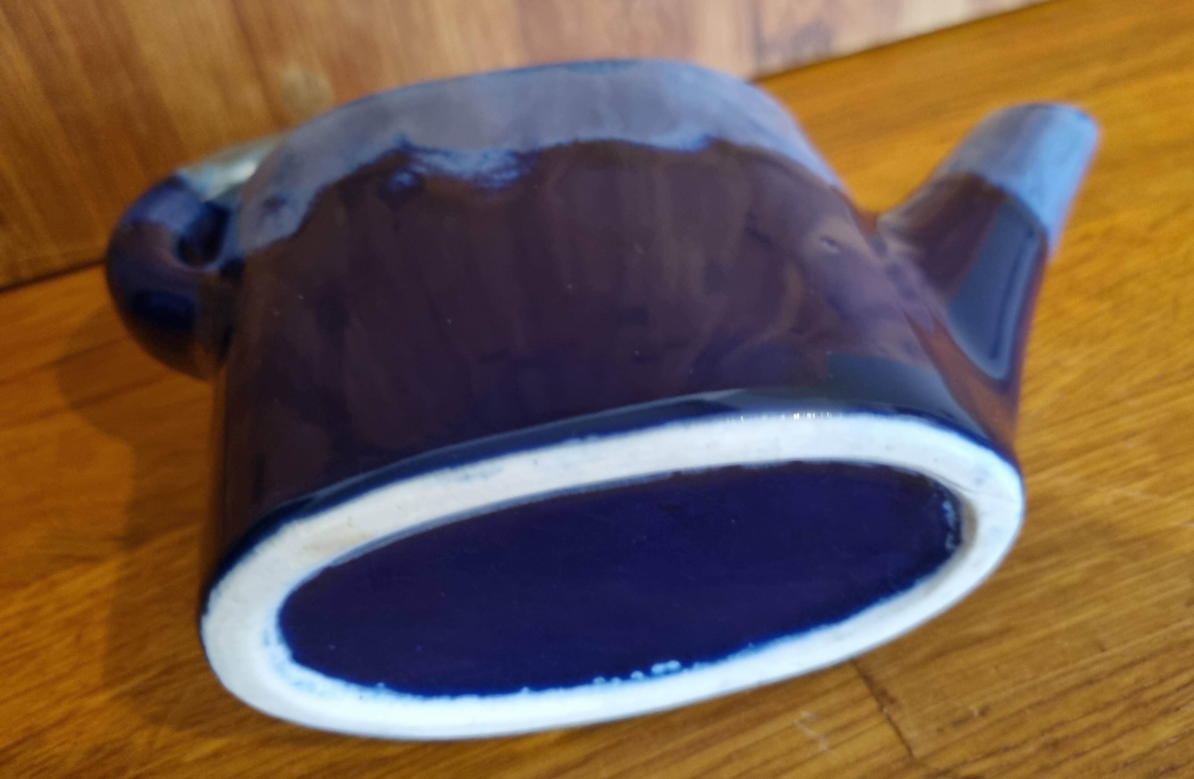 Blue flamed stoneware watering can flower stand