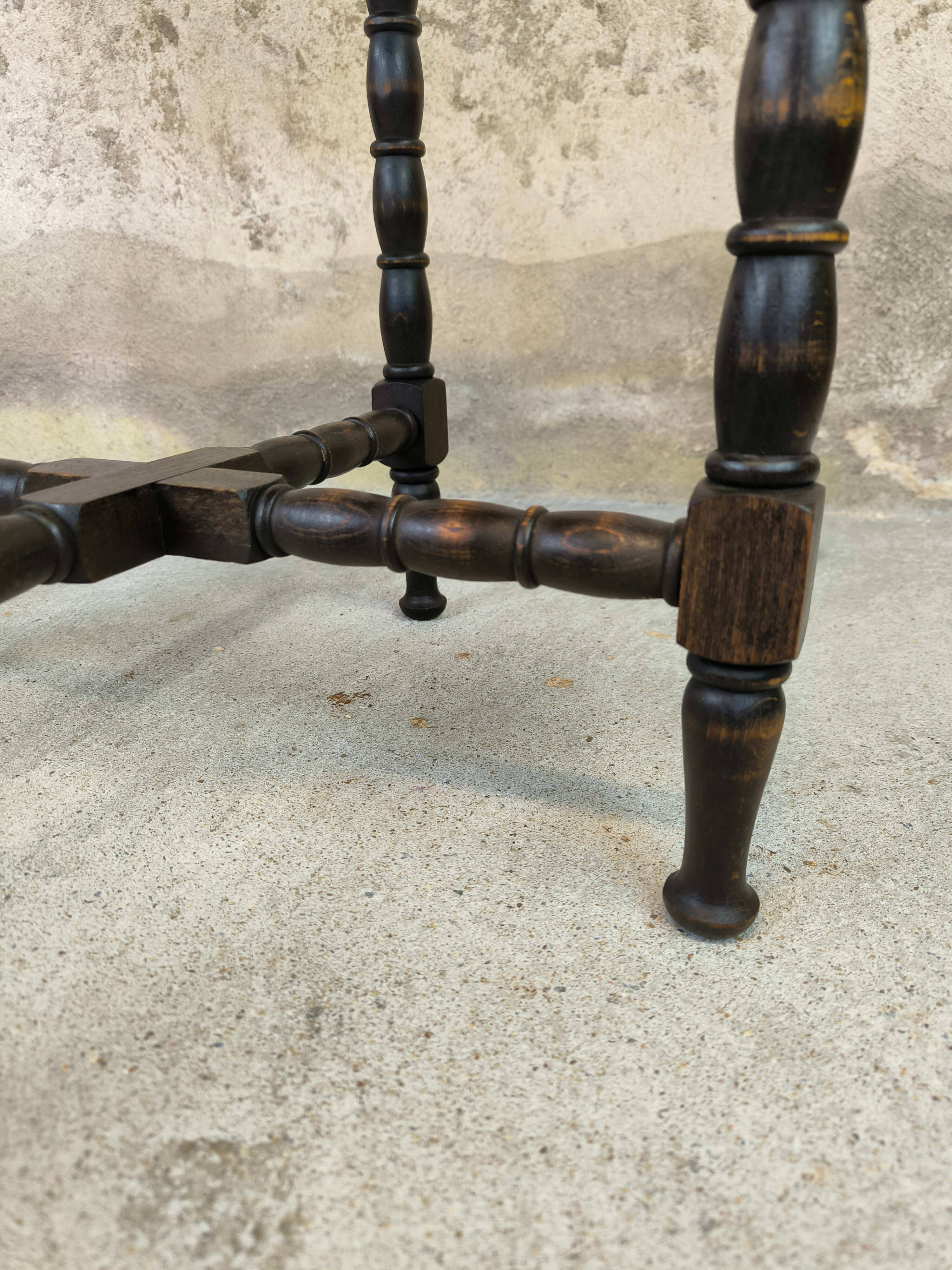 Vintage gueridon with beaded wooden legs.