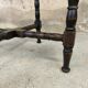 Vintage gueridon with beaded wooden legs.