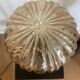 Table lamp with a golden striated globe and a golden base