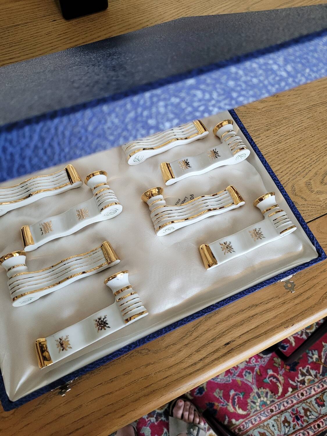 12 Limoges art porcelain knife rests in their case