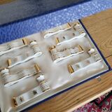 12 Limoges art porcelain knife rests in their case