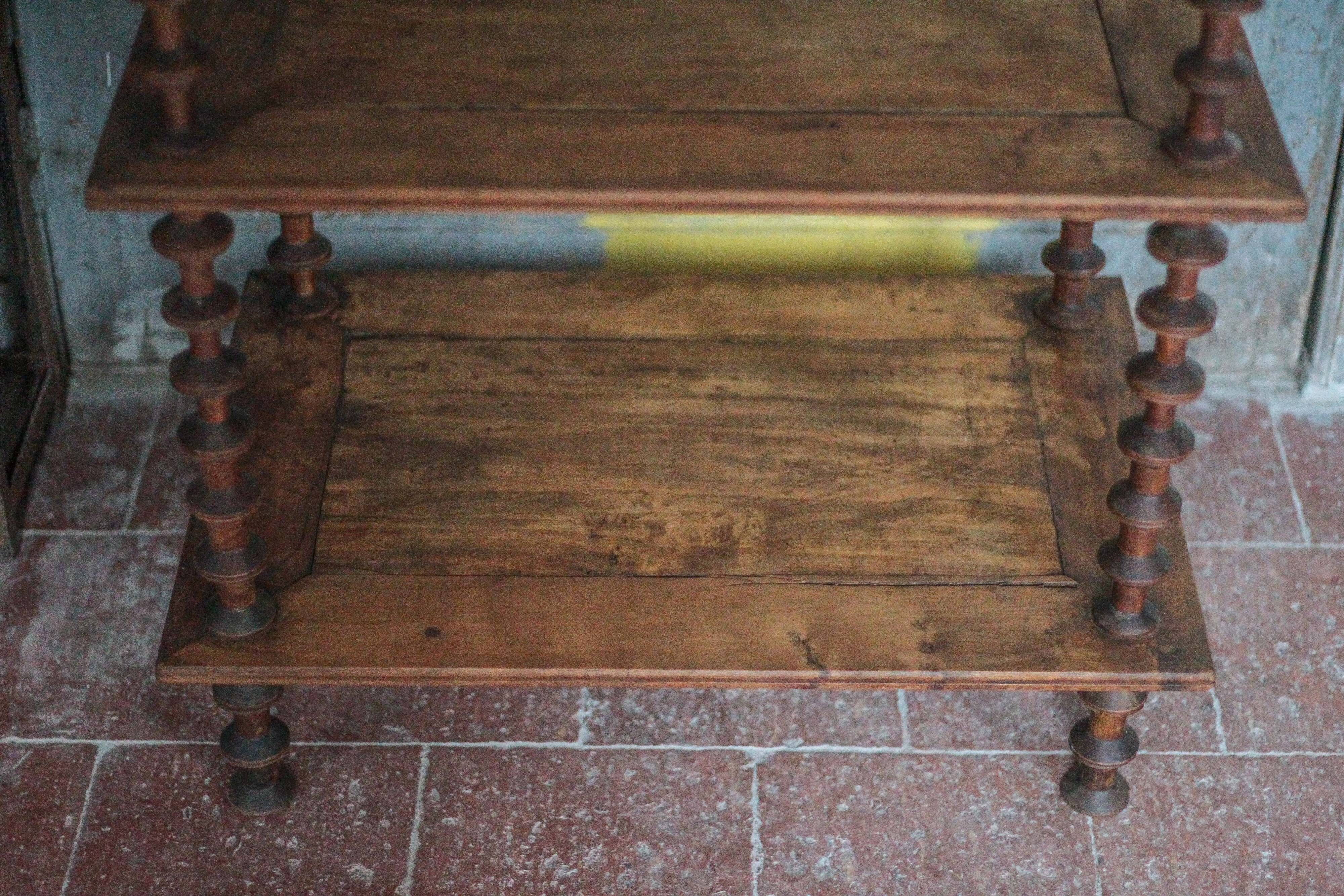 Napoleon III spool shelf, floor-standing shelf with brass tips.