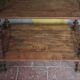 Napoleon III spool shelf, floor-standing shelf with brass tips.