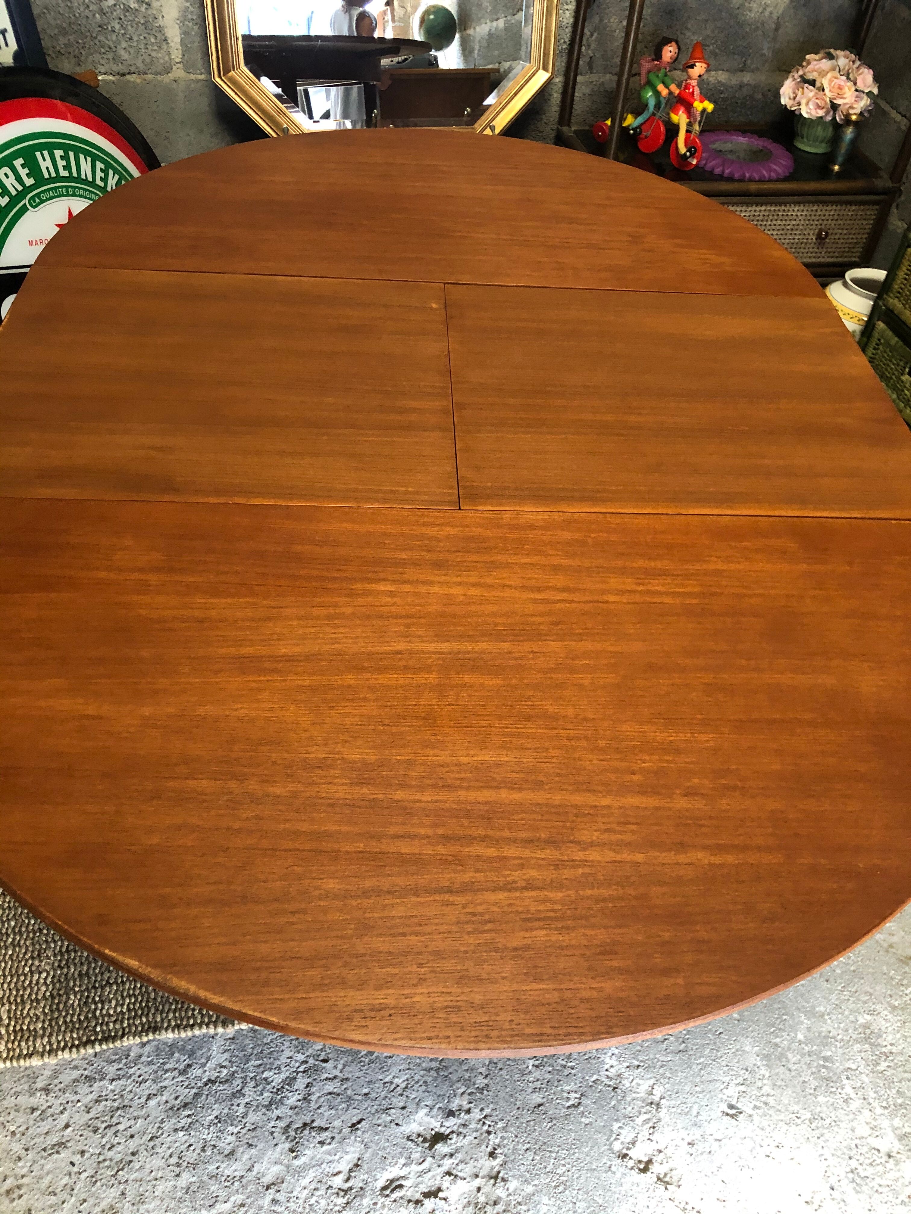 Teak round table with built-in extension