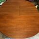 Teak round table with built-in extension