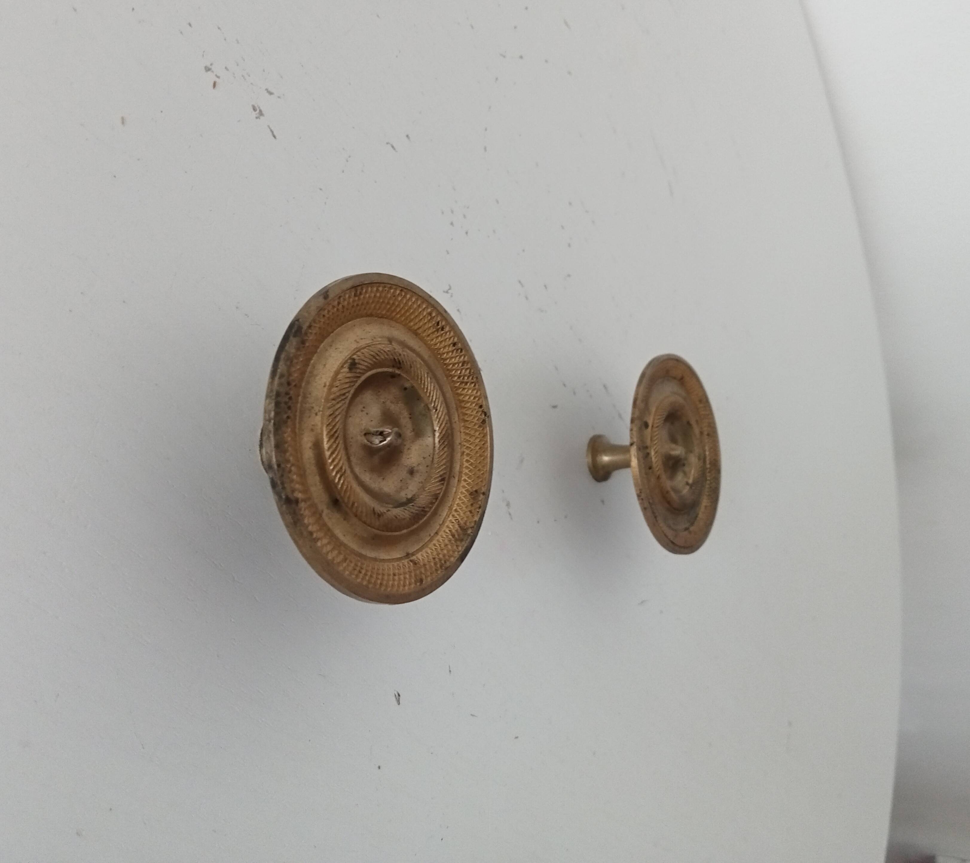 Pair of antique Empire furniture knobs from the 19th century in gilded bronze.