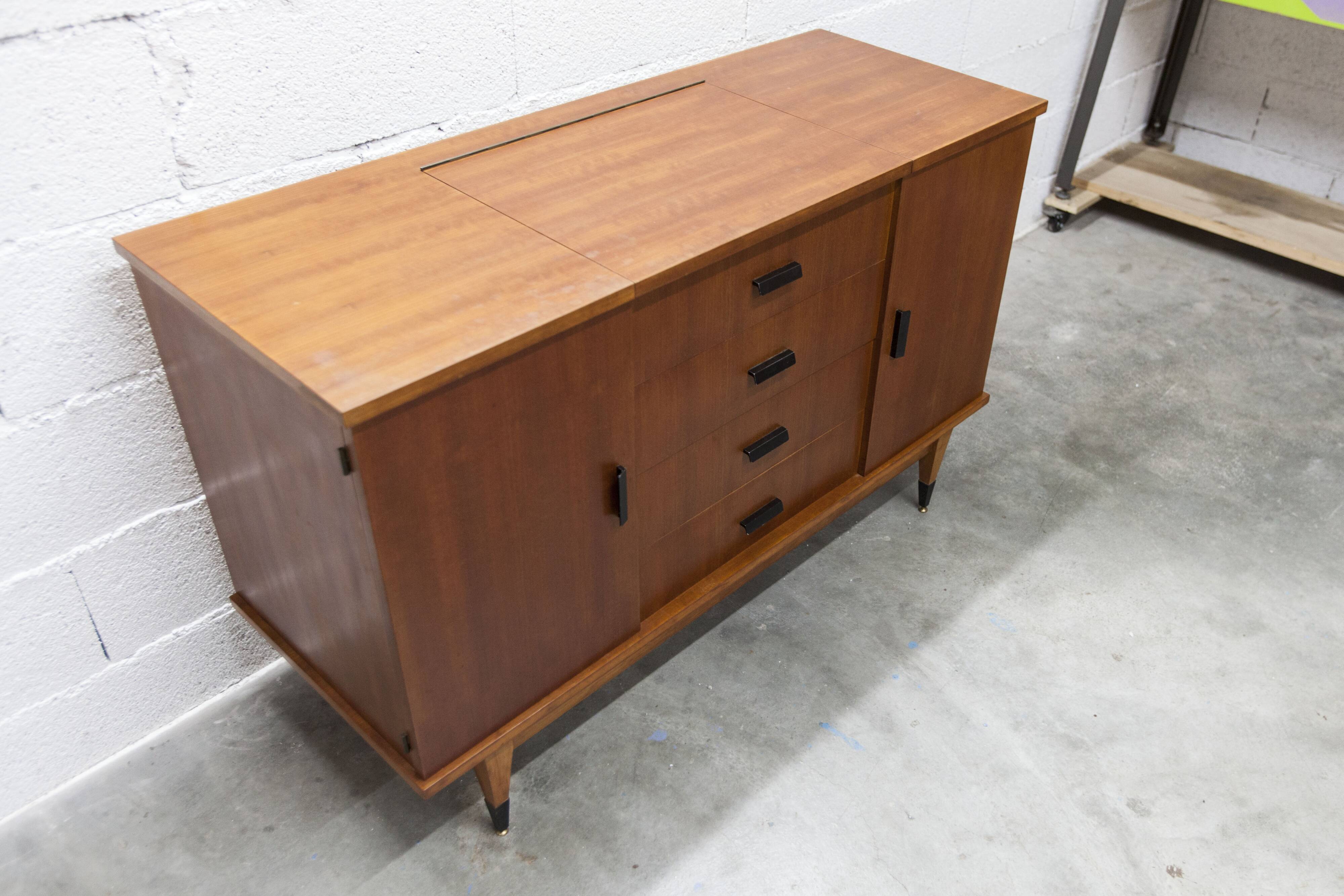 1960s teak sideboard with 4 drawers, 2 doors, and a mirror.