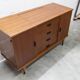 1960s teak sideboard with 4 drawers, 2 doors, and a mirror.