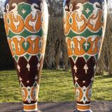 pair of old vases with art deco motifs