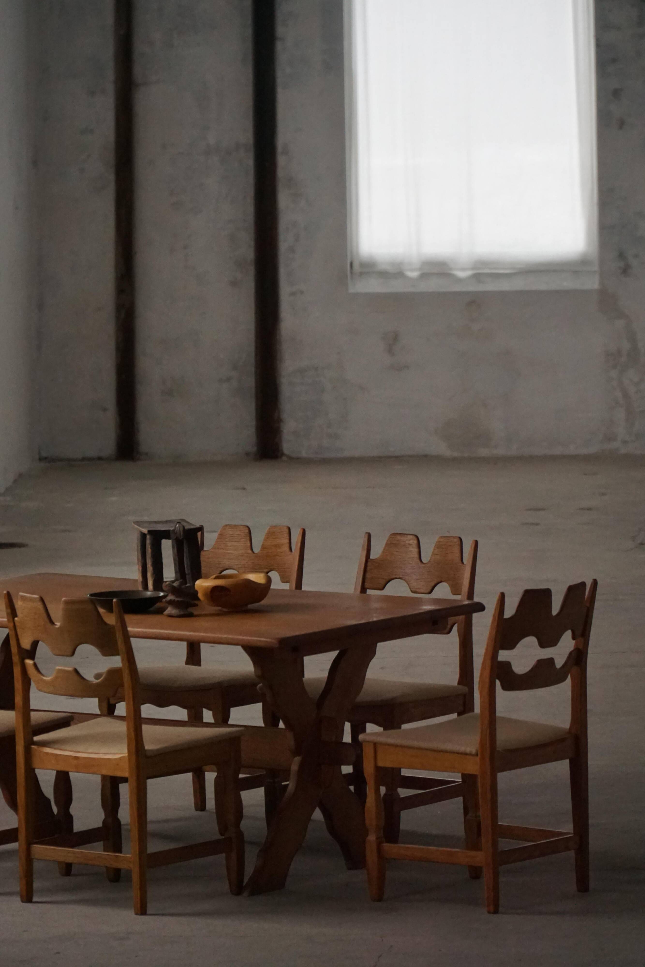 Solid oak dining table with cross base by Danish cabinetmaker, mid-20th century.