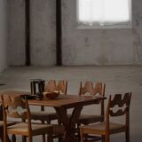 Solid oak dining table with cross base by Danish cabinetmaker, mid-20th century.