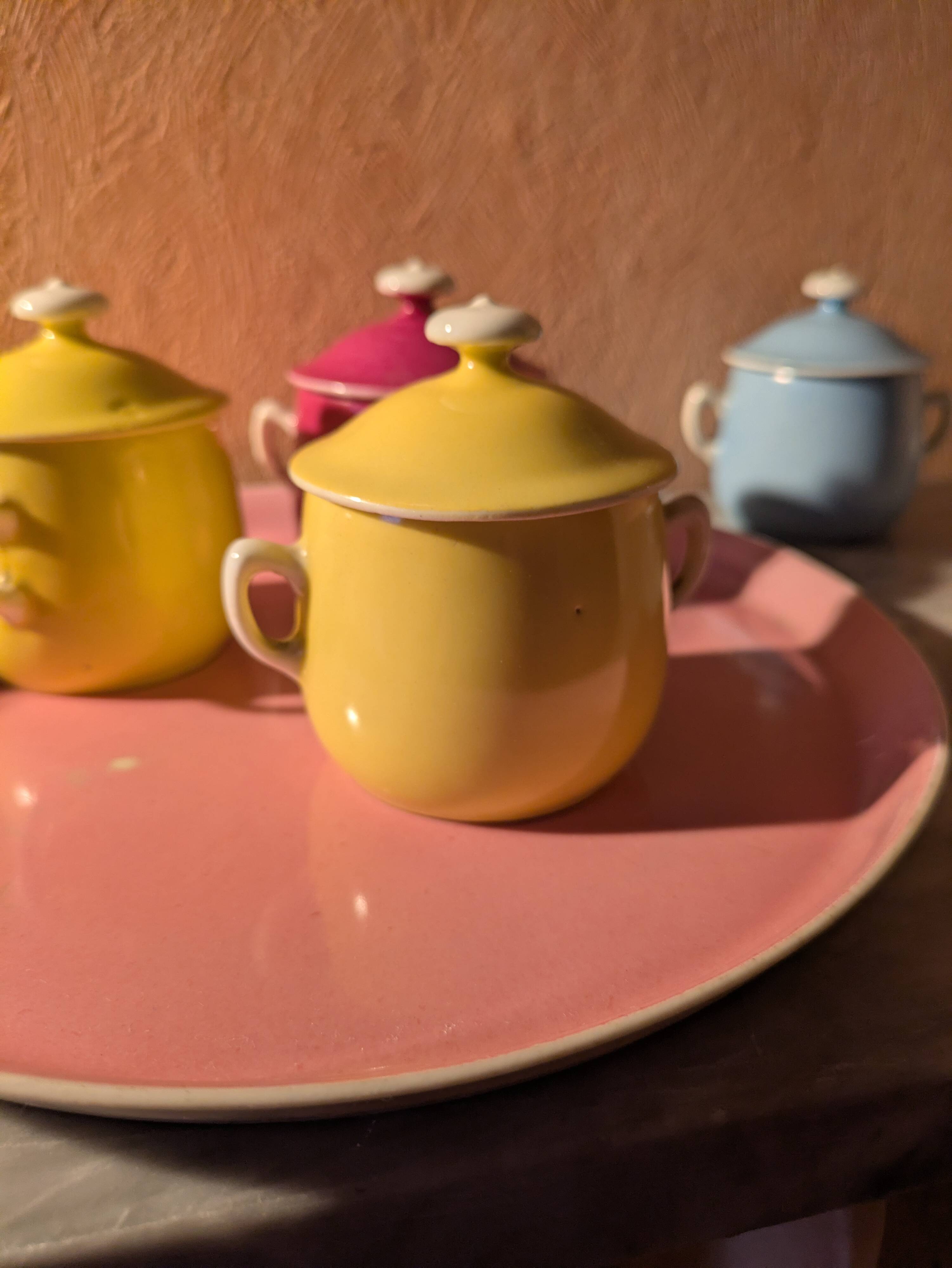 6 small porcelain cream pots from Limoges with a tray.