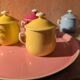 6 small porcelain cream pots from Limoges with a tray.
