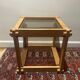 Table brutaliste en bois et verre fumé