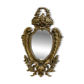 Mirror in the Louis XV Rocaille style in gilded bronze.