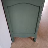 Dark green patina crossbow chest of drawers