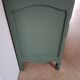 Commode arbalete patine vert foncé