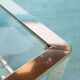 Minimalist coffee table in brass and glass, Regency style from the 1970s.