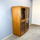 Art Deco cabinet with glass doors, various woods, 1930s