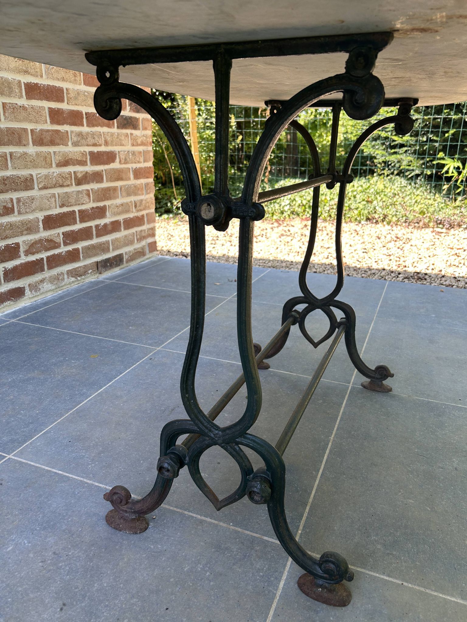 Art Nouveau cast iron and marble bistro table.