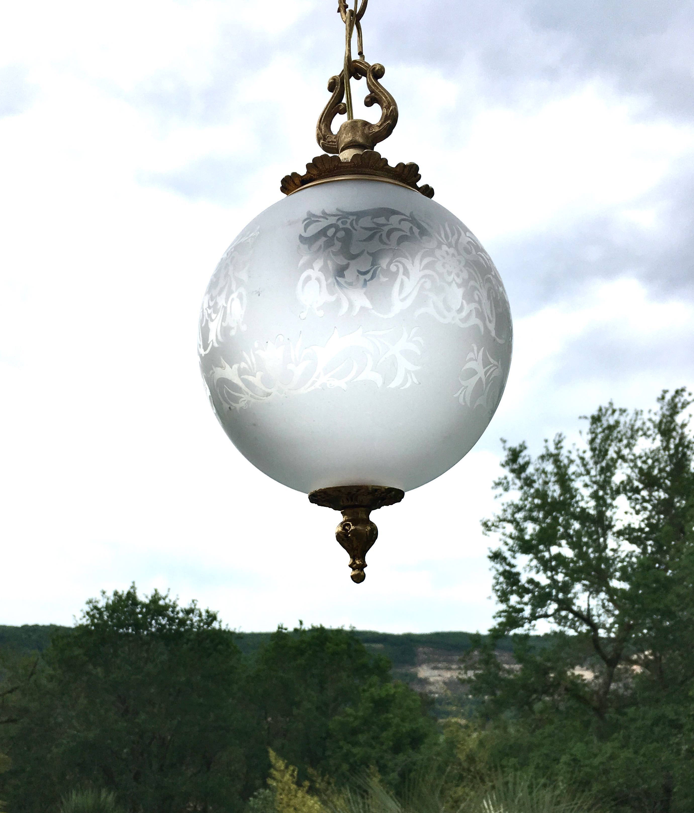 Floral globe and gold metal hanging lamp