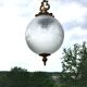 Floral globe and gold metal hanging lamp