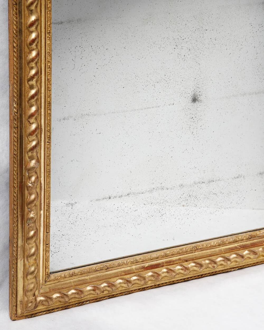 Louis-Philippe mirror with a geometric scalloped frame