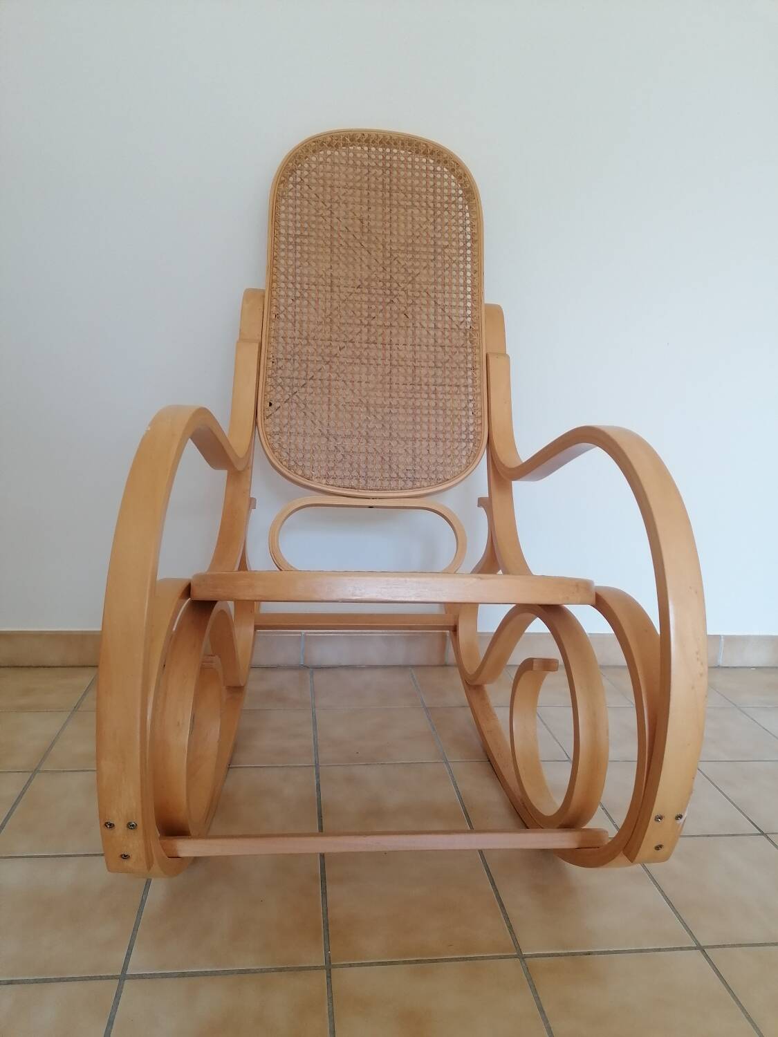 Wooden and cane rocking chair