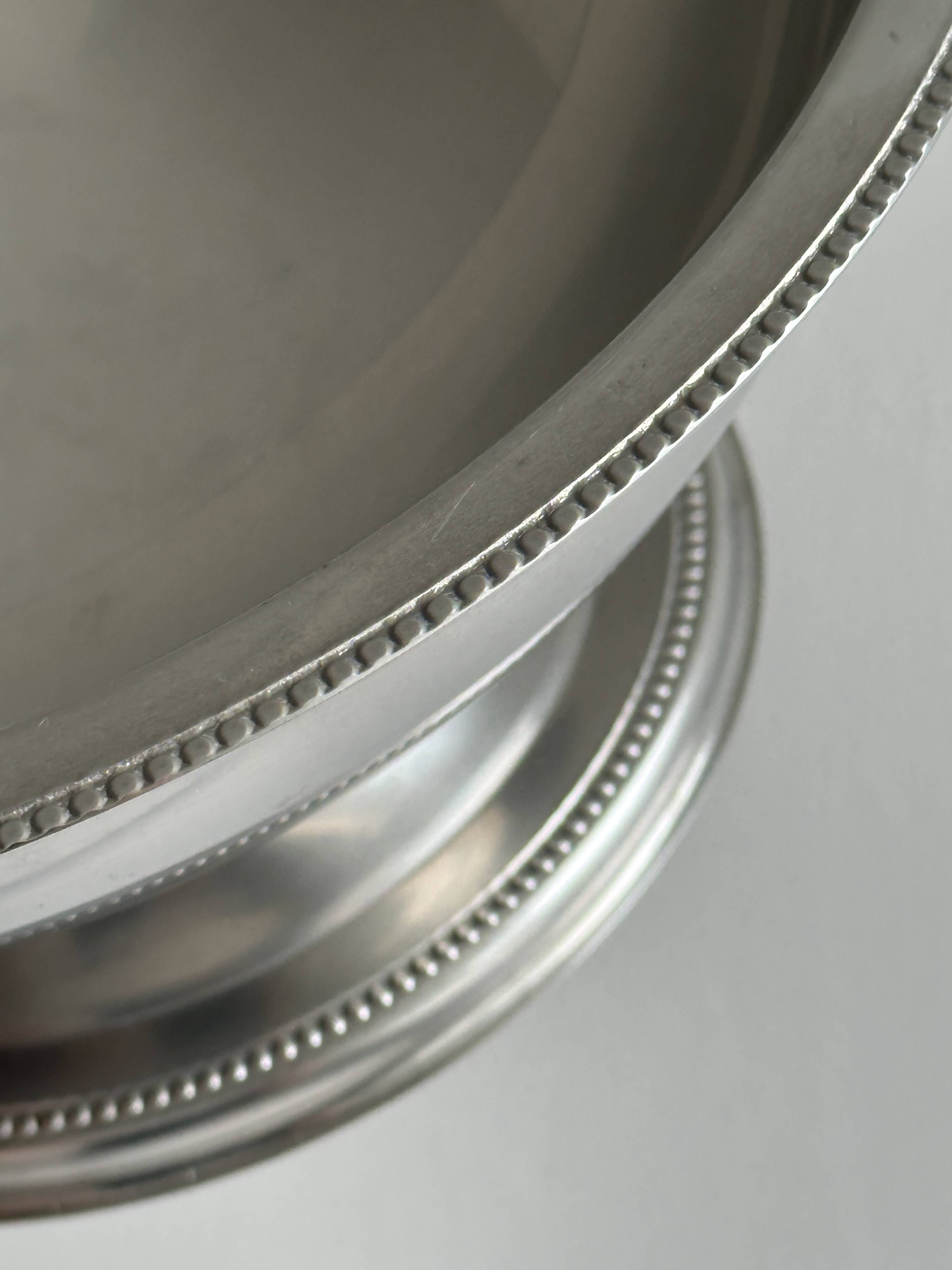 Shiny silver metal salad bowl