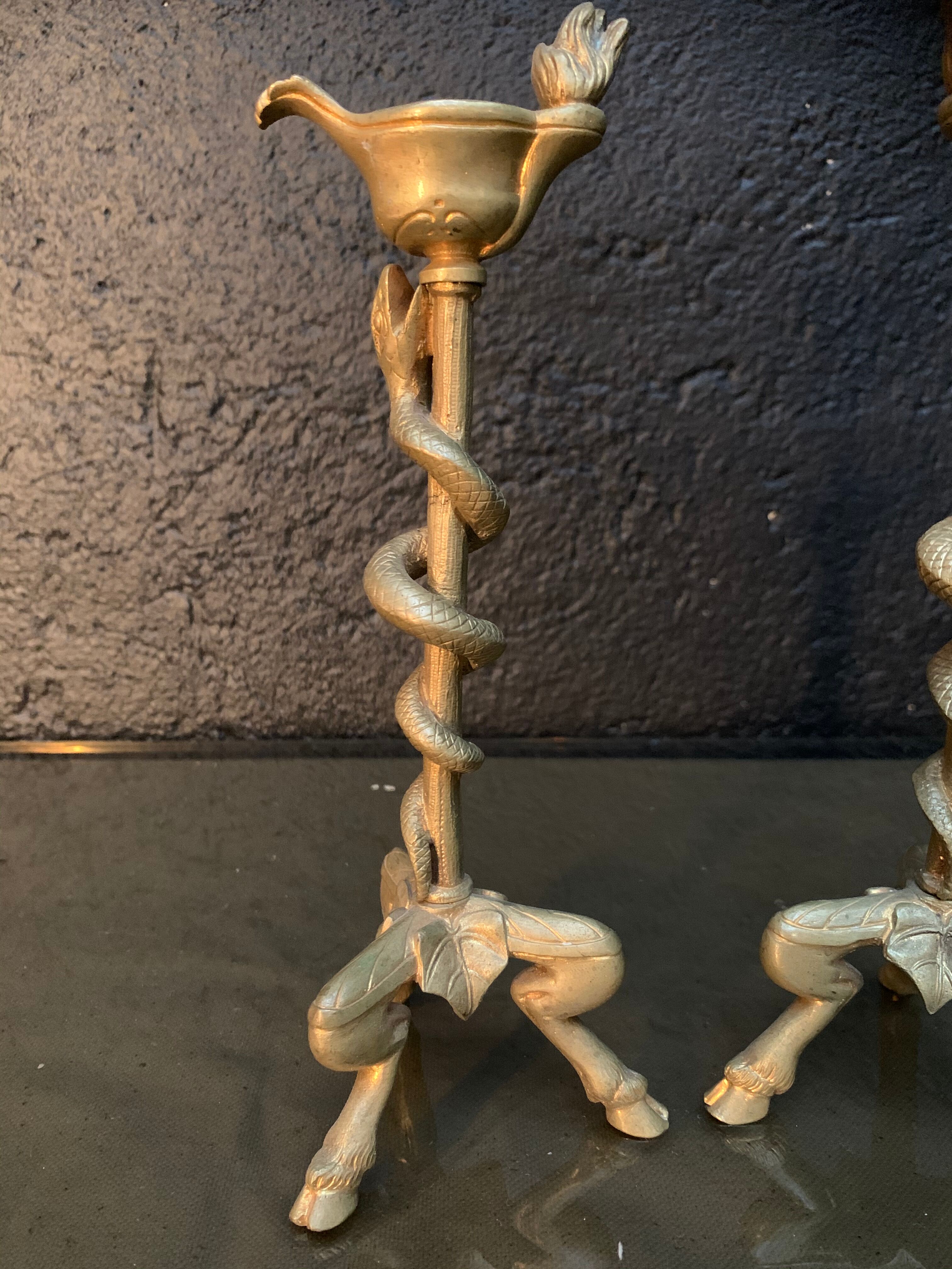 Pair of candlesticks with snakes, gilded bronze 19th century