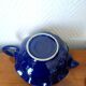 Blue ceramic Art Deco teapot with a frog.