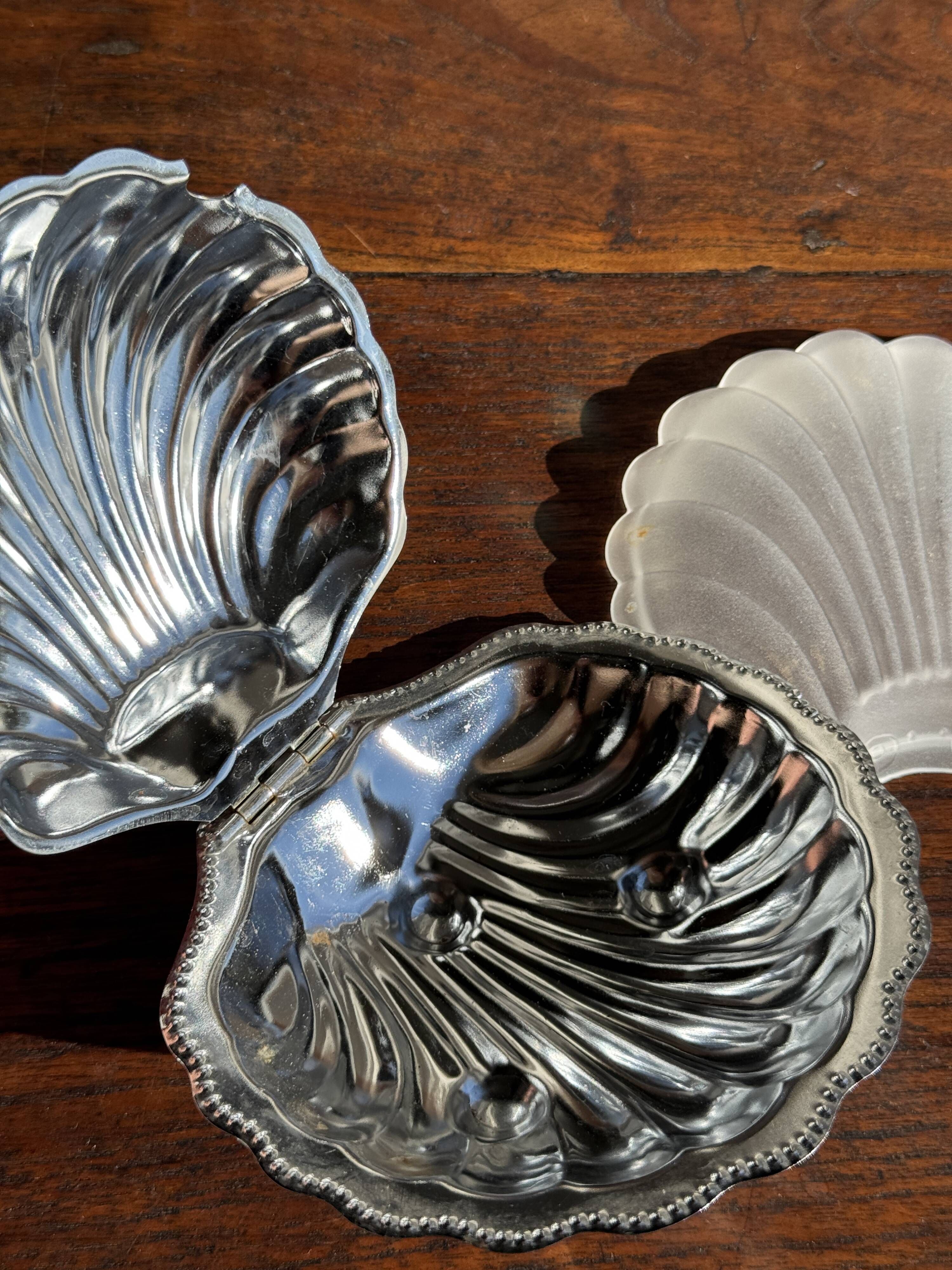 Vintage silver-plated shell butter dish with transparent bowl.