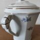 Antique porcelain sugar bowl with a decagonal base.
