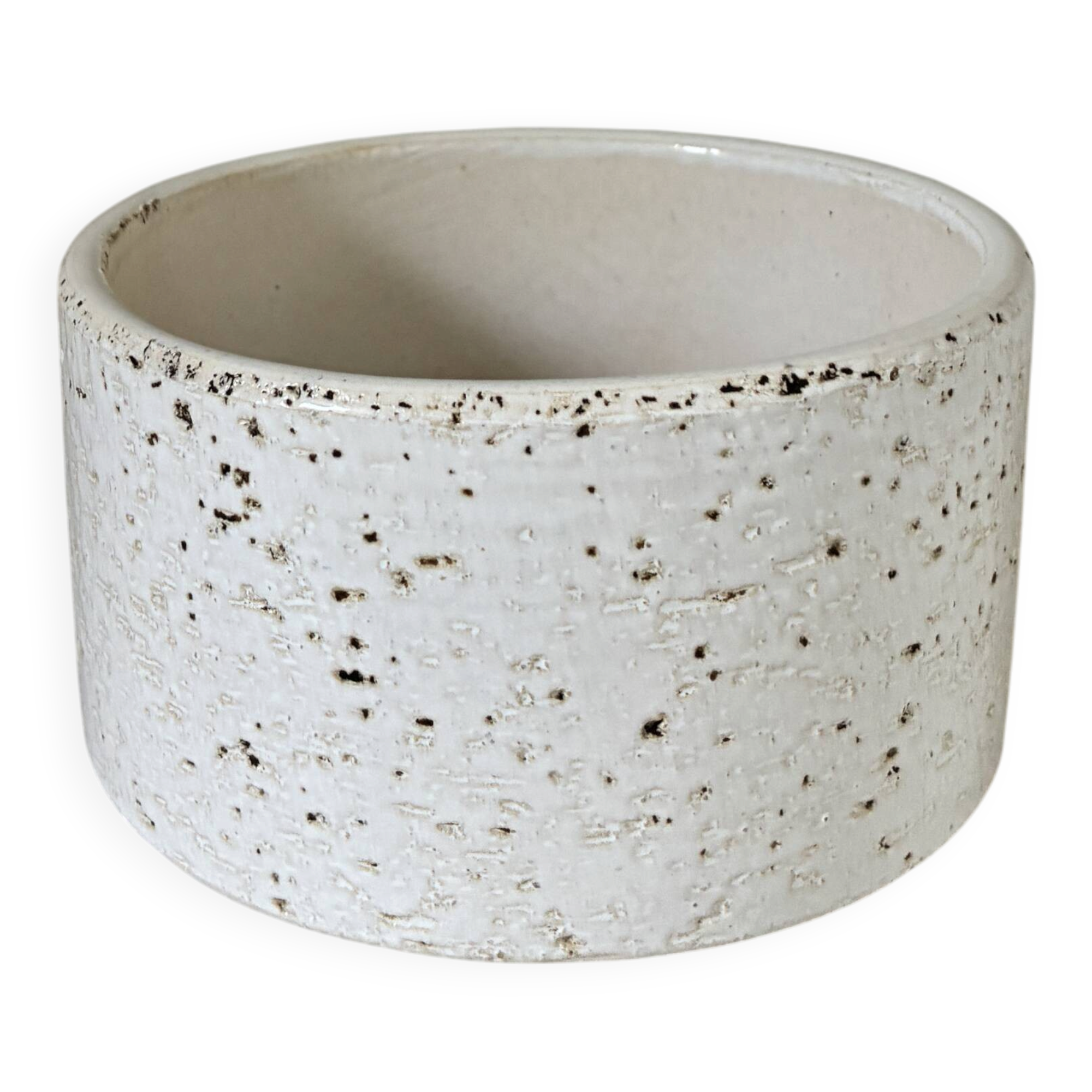White ceramic vase with a textured effect.
