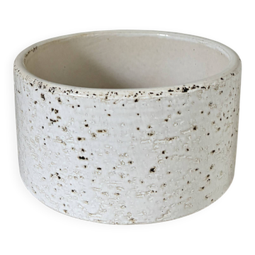 White ceramic vase with a textured effect.