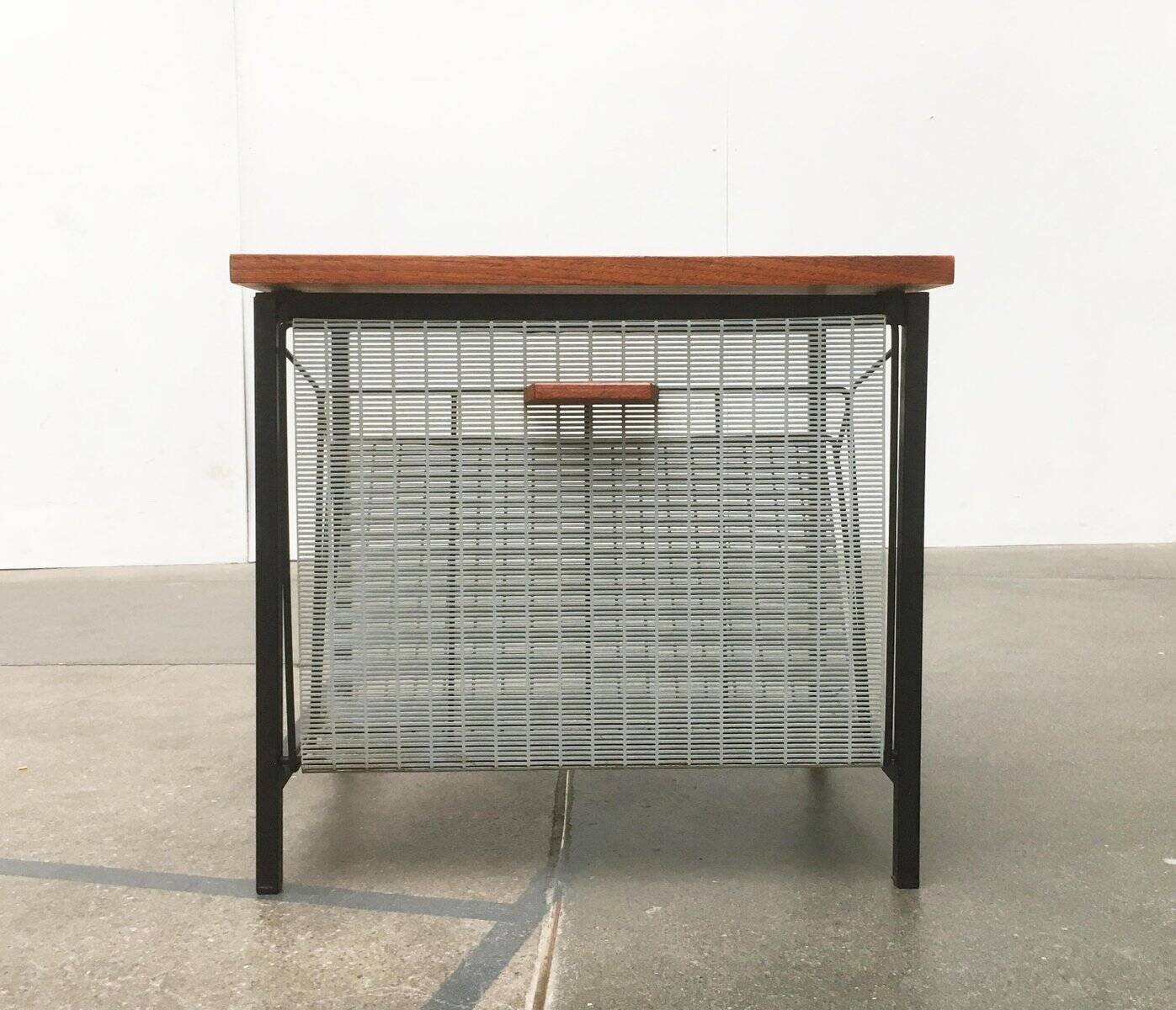 Mid-century teak side table with magazine rack.