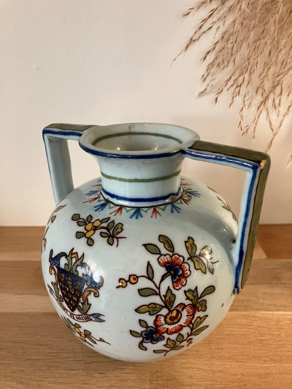 Old vase with floral motif inspired by desvres earthenware