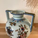 Old vase with floral motif inspired by desvres earthenware